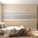 Soft-hued beach landscape wallpaper featured in a calming bedroom space