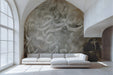 Modern living room wall featuring an abstract beige calligraphic wallpaper mural