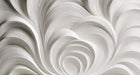 Abstract wallpaper pattern with sweeping monochromatic white and dove gray organic swirling curves