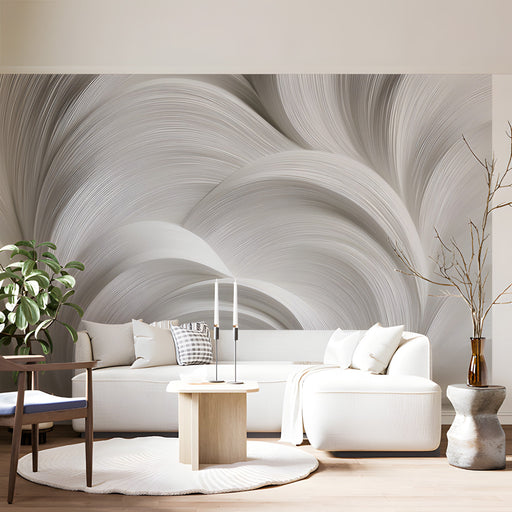 Modern living room with organic fluid swirl wallpaper behind a minimalist charcoal sofa