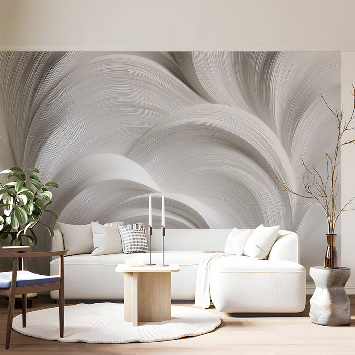 Modern living room with organic fluid swirl wallpaper behind a minimalist charcoal sofa