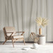 Contemporary study design with subtle cream-toned vertical ribbon wallpaper mural
