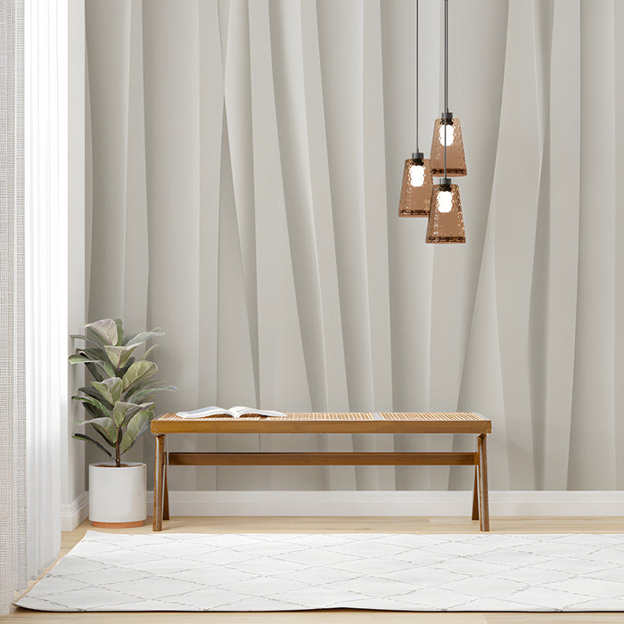 Minimalist study with soft off-white folded wall mural behind a modern beige sofa