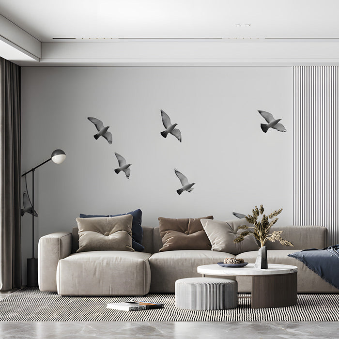 A minimalist home office space with bird mural wallpaper creating a calm, open atmosphere.