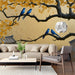 Living room interior featuring a luxury mural with golden ginkgo leaves and blue birds