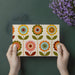 Colorful floral wall mural behind a home office desk, providing a creative and upbeat workspace environment.