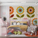 Mid-century retro floral wallpaper installed in a bright modern bedroom with wooden cabinets.