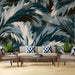 Modern living room interior with abstract painterly leaf wallpaper as a striking headboard feature wall.