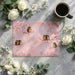A cozy reading nook featuring an owl and pink floral mural with a plush armchair.