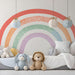A modern bedroom space with a minimalist rainbow arch feature wall and light wood furniture.