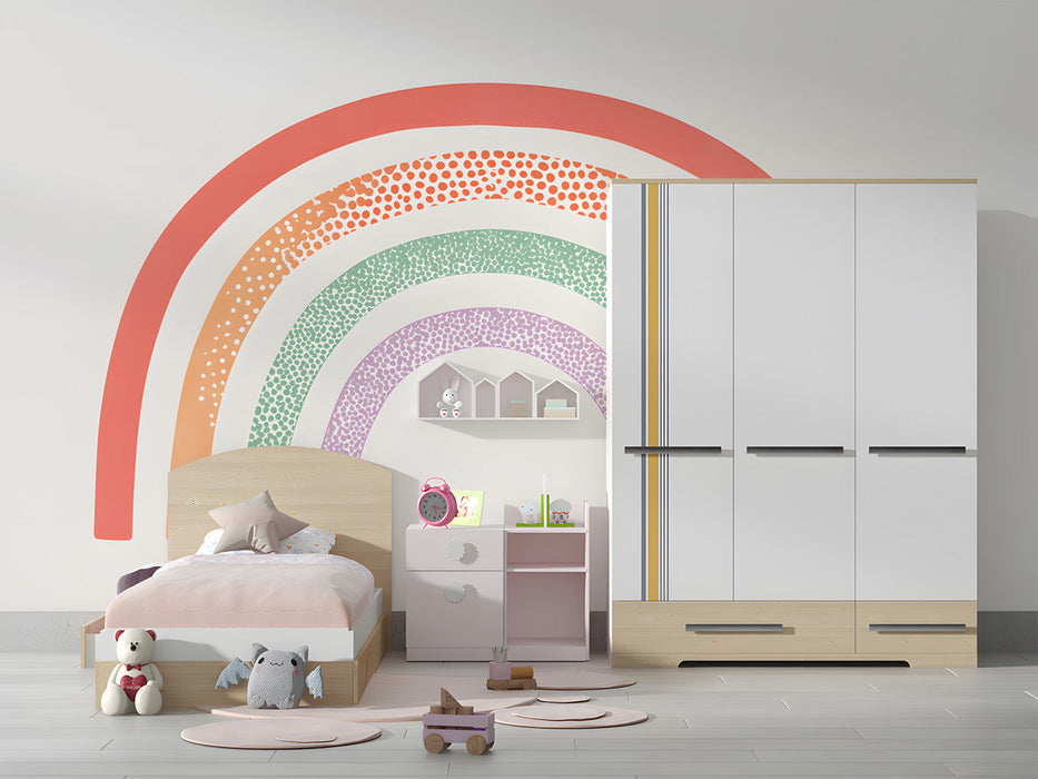 A bright nursery featuring a pastel rainbow arch mural above a wooden crib with neutral textiles.