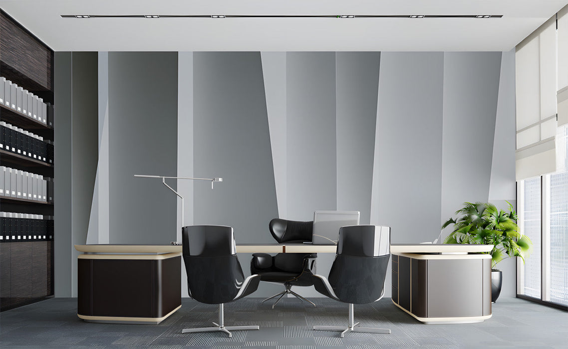 Modern office space with a geometric vertical line wallpaper mural behind a desk