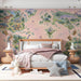 A bright bedroom interior with a prehistoric map mural on the wall and wooden toy storage baskets.
