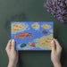 Marine biology themed wallpaper design showcased in a colorful home playroom.