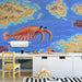 Ancient sea creature mural featured in an educational study room or library.