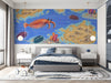 Prehistoric ocean wallpaper installed in a child's bedroom with light wooden furniture.