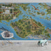 A cozy nursery room decorated with an educational dinosaur world map mural and light colored wooden accents.