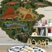 Prehistoric Pangea mural installed in a cozy child’s nursery with wooden furniture