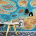 A kid's playroom featuring an educational prehistoric ocean wallpaper on the main wall with wooden furniture.
