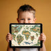 A bright playroom featuring a prehistoric world map mural as a decorative accent wall.
