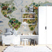 Educational animal map mural in a child's study with colorful soft toys