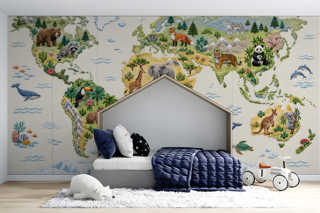 Embroidered world map mural installed in a cozy bedroom with wooden crib
