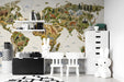 A cozy nursery room featuring a world map wallpaper that brings an adventurous and educational mood to the space.