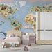 World atlas mural in a child's study room with desk and globe decor