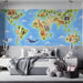 Children's bedroom featuring a world map animal mural on the main wall behind a white wooden crib.