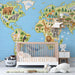 A colorful elementary bedroom featuring a detailed animal world map mural on a large feature wall.