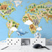 A bright, cheerful nursery room with a world map mural featuring friendly animals on the main wall.