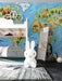 Animal world map mural installed on a nursery wall with white crib and wooden toy accents