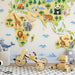 An educational home office space decorated with a paper-fold style world map wallpaper and a modern desk.
