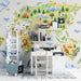 A bright study wall featuring an origami animal map, colorful wooden toy bins, and natural light.