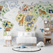Playful wildlife world map wall mural in a bright family bedroom setting