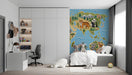 The world map mosaic wallpaper installed in a bright, modern study with wooden crib and play area.