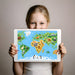 Educational animal world map wallpaper featured on a bedroom wall behind a toddler bed