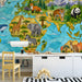 Stained glass world map mural installed in a modern study with light wood crib