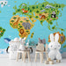 A bright, cheerful world map wallpaper in a nursery, creating an engaging and fun environment for young children.