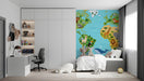 A colorful world map wallpaper installed in a child's bedroom with wooden toys and a cozy bed.
