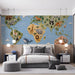 A children's bedroom area featuring the educational world map wallpaper above a small desk.