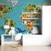 Playroom wall decorated with an educational world map mural showing clay style wildlife.