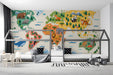 A vibrant playroom setup showing the animal map wall mural as a backdrop for a reading nook and toy storage.