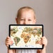Animal world map wallpaper in a home study room with a dark wood desk