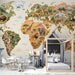 Educational mural wallpaper of a world map in a bright bedroom for kids