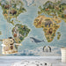 A playroom with a world map wall mural featuring wildlife illustrations in soft blue and earth tones.