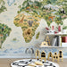 Global map wall decor in a bright nursery room with neutral furniture