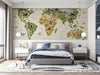 World map mural installed in a colorful kid bedroom with wooden toys