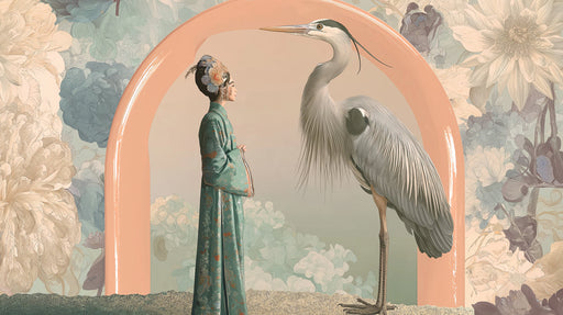 A mural featuring an elegant heron and a woman in teal robes standing before a peach arch with soft oversized floral patterns.