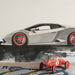 The supercar mural installed in a modern playroom with a minimalist desk.